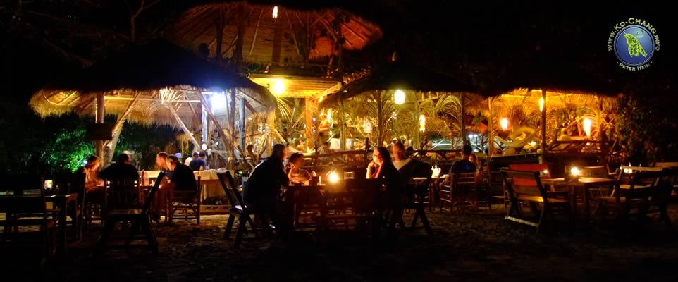 On the beach front of Porn's Restaurant at night time